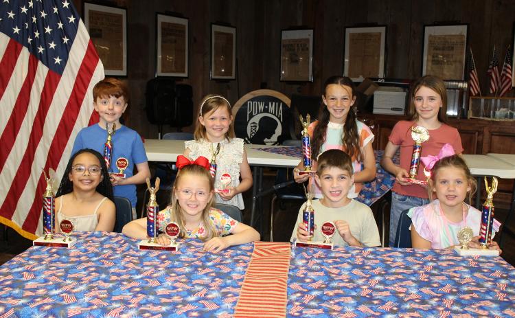 The Veterans of Foreign Wars Post 8971 and the Ladies Auxiliary sponsor Americanism essay contests each year. Winners were named, and cash awards and trophies were presented. Seated, from left, are Charli Rose Papillion, Ruby Bischoff, Case Chapman and Evelina Miller. In back from left are Bryce Duplechain, Rhyn Daggett, Ayda Fuselier and Amelia Daggett. Not pictured are Maxwell Andrepont, Andrew Brown, Lily Briscoe and James Miller.