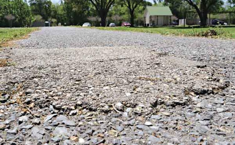 The asphalt track at the walking park is to be widened and repaved with concrete using a $400,000 state grant. (Photo by Harlan Kirgan)