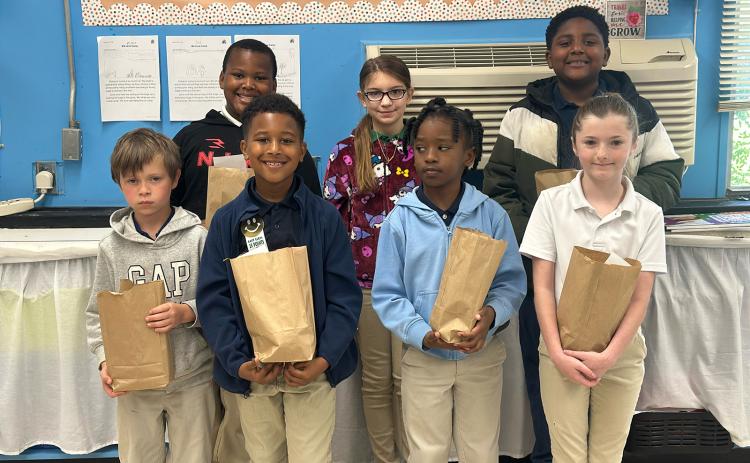 East Elementary celebrated its March Students of the Month. In front from left are Leo Ebers, Drayson Mitchell, Nathaniel Simone, and Danica Bozyone. In back from left are Landon Angelle, Anna Dunn, and Dakarri Janice. Not pictured is Haley Guillory. (Submitted photo)
