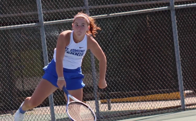 St. Edmund High hosted Sacred Heart Tuesday at the Fairgrounds tennis courts. Stella Summerlin is pictured serving and won her match 8-0. (Photo by Amy Myers)
