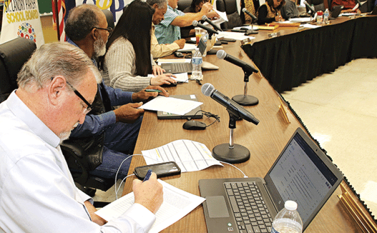 St. Landry Parish School Board members vote on candidates for superintendent at Wednesday’s meeting. (Photo by Harlan Kirgan)