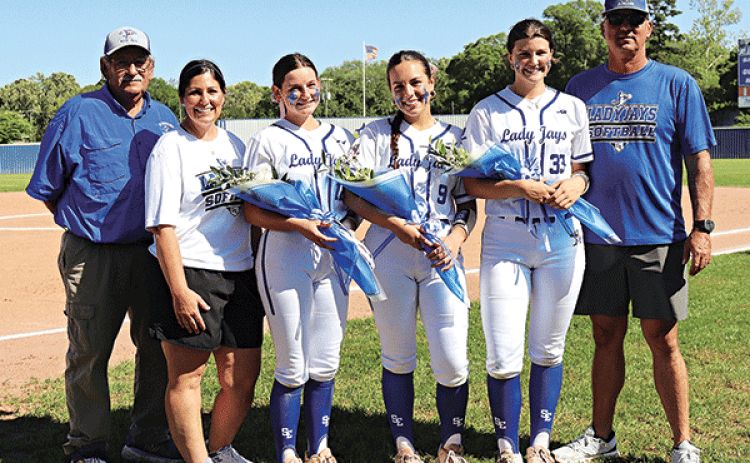 St. Edmund Lady Jays held their Senior night on April 11 before their game against St Louis. The young ladies were presented with flowers and gifts from their coaches, family and friends. Pictured are Coach Harlie Lanthier, Coach Nicole Lanthier, Seniors Emma Myers, Avery Soileau, Kennedy Dubroc and Coach Brock Dubroc. (Photo by Amy Myers)