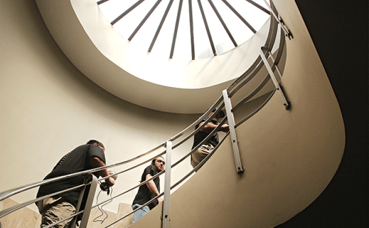 Louisiana Spirits investigators climb to the third floor of the St. Landry Parish Courthouse on April 14 as they looked for spirits. (Photo by Harlan Kirgan)