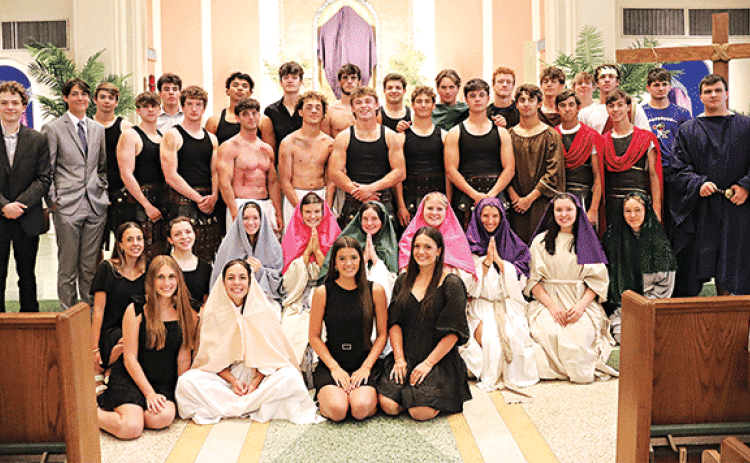 St. Edmund High Senior Class of 2025 presented the Way of the Cross Wednesday at St. Anthony of Padua Catholic Church. Mary, betrayed by Emma Clause, holds her son, Jesus, Koy Trahan, after he was taken down from the cross. (Photos by Amy Myers)