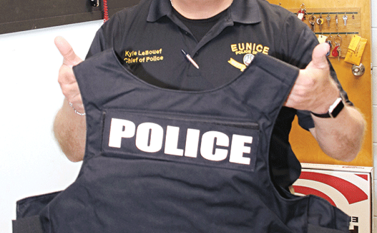 Eunice Police Chief Kyle LeBouef displays one of 15 armored vests the department received last week. (Photo by Harlan Kirgan)