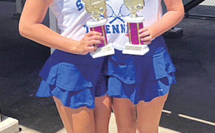 Jillian DeVillier, left, and Clara Brown, both seniors at St. Edmund High School, are regional champs, girls doubles, in tennis. The duo played  in Alexandria in the Division IV, Regional II Tennis Tournament. They won 6-3, 6-4 in the championship round against a team from Menard High. DeVillier has won regionals four years in a row and Brown has won regionals two years in a row. (Submitted photo)