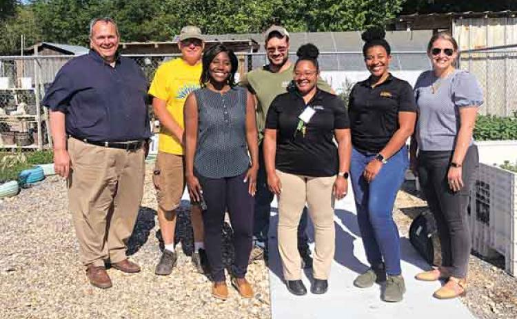 Partnering with Food Farmacy program at the Eunice Community Garden are representatives from Second Harvest. Personnel visited recently at the garden. In front, from left, are Brittany Bowie, impact operations manager; Valerie Thompson, impact coordinator; Kristen Wesley, community nutrition manager; and Lindsay Hendrix, chief impact officer. In back, are Paul Scelfo, regional director; Randy Miller, administrator at Eunice Community Garden; and Paul Ganucheau, volunteer. (Submitted photo)