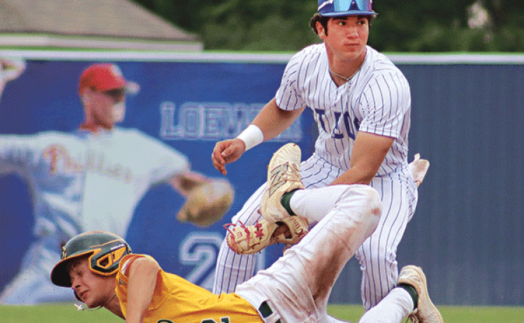 St. Edmund’s Kane West makes a tag at 2nd base in the 5-4 win over Cedar Creek on Wednesday. (Photo by Amy Myers)