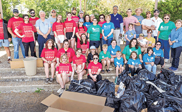 Volunteers fanned out across Eunice on Saturday for the Love the Boot cleanup organized by Keep Eunice Beautiful. Some of the volunteers are shown at the Eunice Municipal Complex with filled trash bags. Donna Baltakis, Keep Eunice Beautiful director, said the Eunice High Spirit Group and National Honor Society spent 3 hours and 48 students picked up 52 30-gallon bags last week. New Hope Fellowship spent 10 hours painting, planting and cleaning up elementary schools with 24 people. On Saturday, 62 people fil