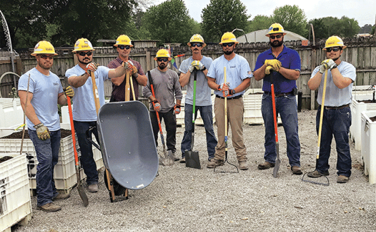 Cleco employees at the Eunice Community Garden on Friday. They were not identified. (Submitted photos)