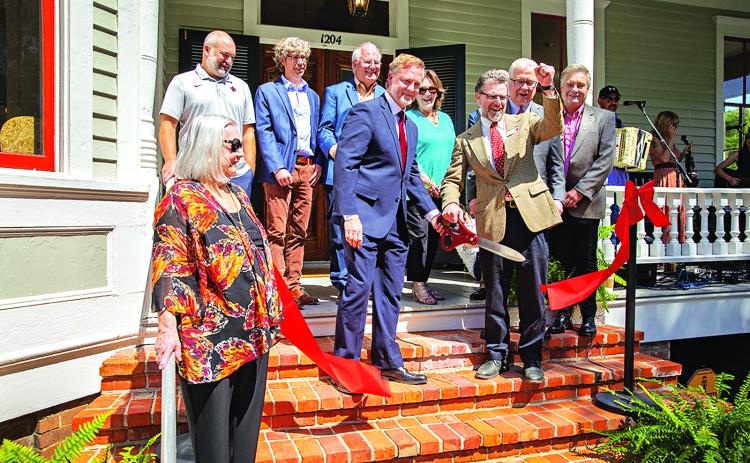 Representatives of UL Lafayette, its Center for Louisiana Studies and contributors to the recent renovation of the Roy House attended a Thursday ribbon-cutting ceremony. Shown, from left, are: Dr. Vaughan Baker, former department head; Scott Hebert, director of Facility Management; Scott Chappuis, Architects Beazley Moliere; Robert “Popie” Billeaud, J.B. Mouton Builders; Dr. Joshua Caffery, center director; Rita Durio, Rita Durio and Associates; Dr. Jordan Kellman, College of Liberal Arts dean; Dr. Joseph S