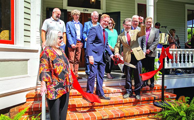 Representatives of UL Lafayette, its Center for Louisiana Studies and contributors to the recent renovation of the Roy House attended a Thursday ribbon-cutting ceremony. Shown, from left, are: Dr. Vaughan Baker, former department head; Scott Hebert, director of Facility Management; Scott Chappuis, Architects Beazley Moliere; Robert “Popie” Billeaud, J.B. Mouton Builders; Dr. Joshua Caffery, center director; Rita Durio, Rita Durio and Associates; Dr. Jordan Kellman, College of Liberal Arts dean; Dr. Joseph S