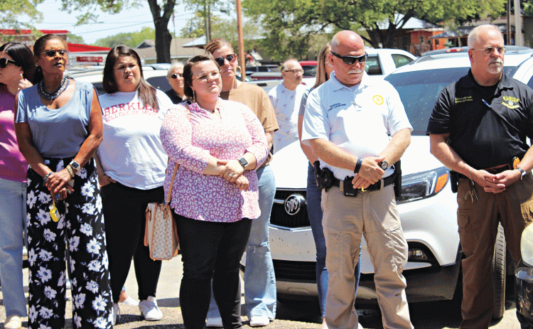 People gathered at the parking lot and pavilion of City Hall Thursday at noon for National Day of Prayer. In front, from left, are Angelia Guillory, Alison Duplechain, City Marshal Terry Darbonne and Eunice Police Chief Kyle LeBouef. More photos from the event are on Page 10. (Photo by Myra Miller)