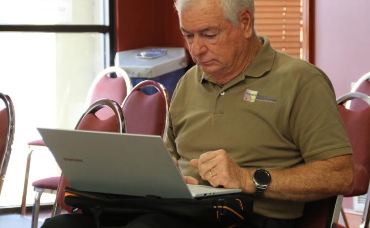 Demographer Mike Hefner at a St. Landry Parish Council meeting. (Photo by Harlan Kirgan)