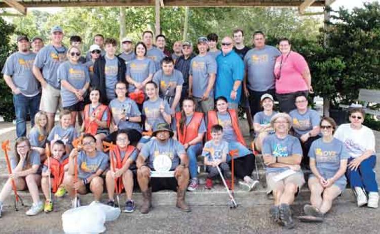 Cleanup volunteers gather for a photo after they were done in May 2021. A pre-Mardi Gras cleanup is planned on Feb. 19 and another week of cleanups is planned in April. (File photo)