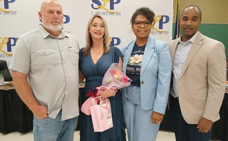 Schouest is pictured with her husband, James Schouest Jr., Superintendent Milton Batiste III and Sylvia Brown.