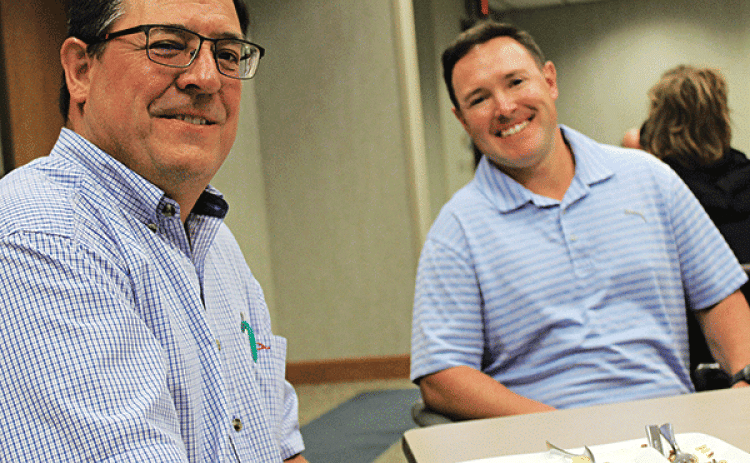 Raymond Aguillard, left, and Andre Aguillard, guest speaker Wednesday at the Eunice Rotary Club meeting. Andre Aguillard spoke about natural gas storage at the Pine Prairie Energy Center. (Photo by Myra Miller)