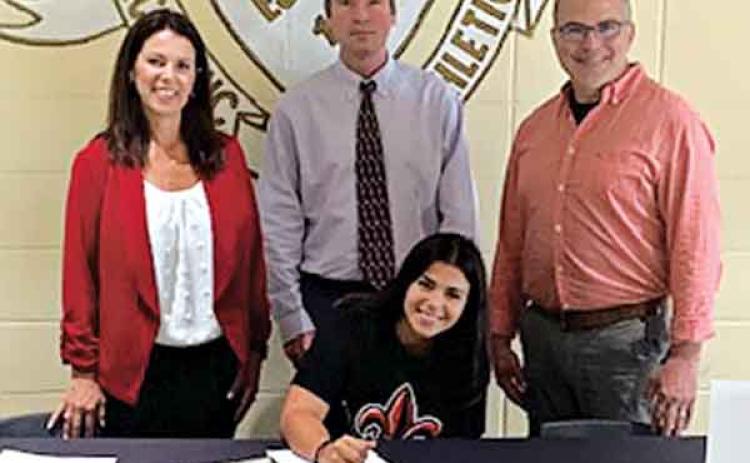 Eunice High School senior Kelly Sonnier accepted a full scholarship to the University of Louisiana Lafayette and to march with the Pride of Acadiana, the UL Marching Band.  Seated is Kelly Sonnier, and standing, from left, are Becky Sonnier, mother, Lamont Goodman EHS band director, and Mike Sonnier, father. (Submitted photo)