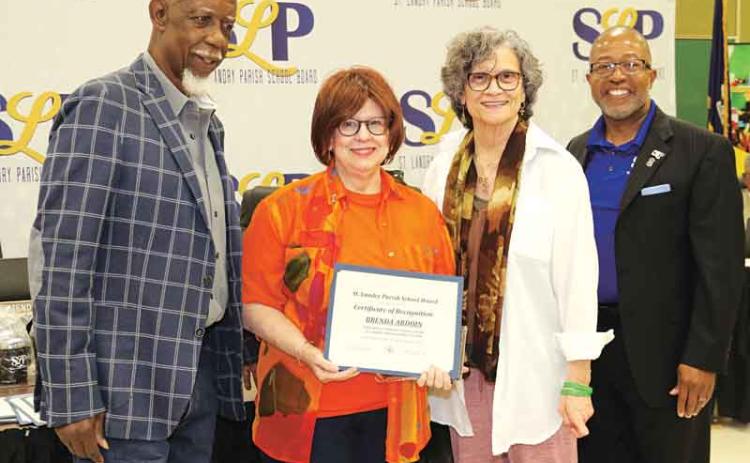 The St. Landry Parish School Board recognized retirees at its Thursday meeting. From left, are Albert Hayes Jr, Board presidnet; Brenda Ardoin, retired from Eunice High as a teacher with 34 years of service; Mary Ellen Donatto, Board member; and Patrick Jenkins, school superintendent. Eighteen retirees were recognized. (Photos by Harlan Kirgan)