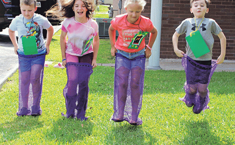 And they are off to the finish line at Happy Days Vacation Bible School at St. Anthony’s Church. The Jeanmard Center was the place to be for children kindergarten through fifth-grade ages. The theme of the Happy Days was, “Stellar Shine Jesus’ Light.” Enjoying a sack race, from left, are Gus Thibodeaux, Raphaela High, Rose Cleland and Jack Turner. (Photo by Myra Miller) 