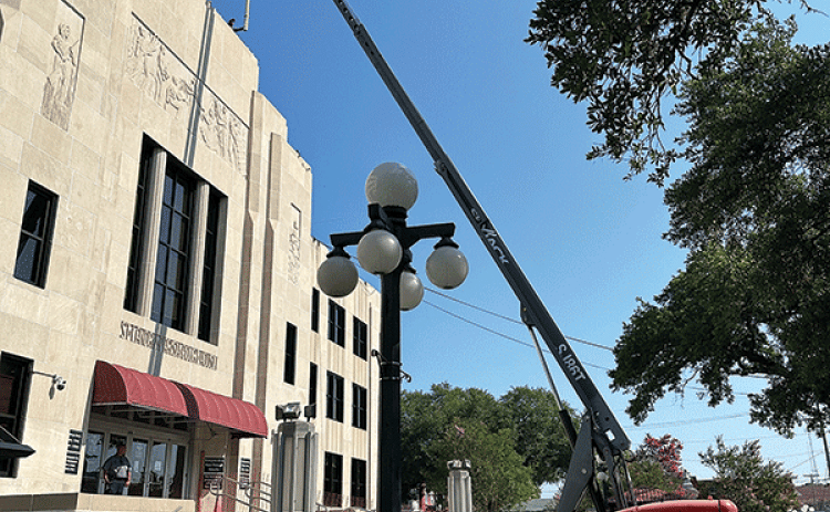 Flag poles were placed on the roof of the St. Landry Parish courthouse on Thursday.  The poles are returning to the roof where they originally were located. There will be three placed on the roof. The pole on the roof will be brought down. It’s part of the courthouse renovation work that includes waterproofing, new energy efficient windows and doors, new awning, a handicapped ramp, new courtroom on the third floor, renovated tax assessor’s office and the old courthouse bell will be placed on the grounds in