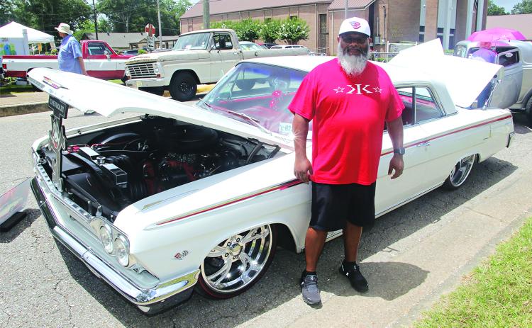 Herman Cassels stands by his 1962 Chevrolet Impala at the Saturday’s Spring Into Summer Car and Truck Show held on 2nd Street and Park Avenue in Eunice. Cassels earned  the Mayor’s Award from Eunice Mayor Scott Fontenot.