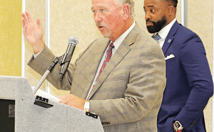 Competing lawyers, from left, Robert Hammonds and Courtney Joiner at Monday’s special School Board meeting. (Photo by Harlan Kirgan)
