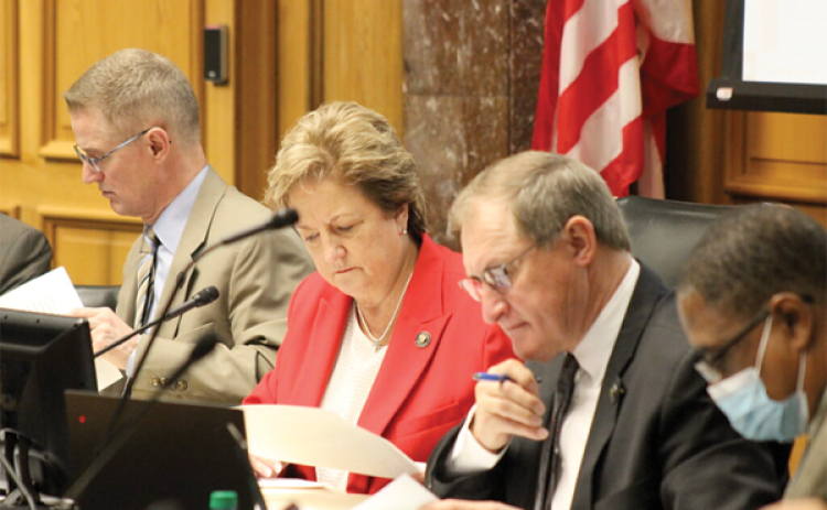 Louisiana legislators, Republican Sen. Sharon Hewitt (middle) and her GOP colleagues Sen. Barry Milligan (left) and Sen. Glen Womack, study new congressional district maps proposed at the Senate and Governmental Affairs Committee on Thursday, Feb. 3, 2022. (Wes Muller/Louisiana Illuminator)