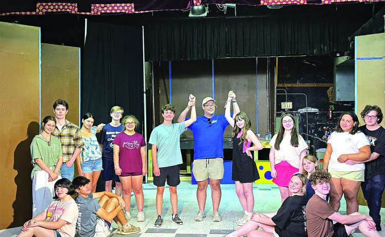 The Eunice Players Theater will stage “Grease” in July at its South 2nd Street theater. Seated, from left, are Amelia Bourgeois as Marty, Leo Spell as Sonny, Josephine Ohlenforst as Frenchie, and Phillip Cormier as Doody. Standing, from left, are Rose Young as Jan, Joe Aucoin as Roger, Laylah Glland as Patty Simcox, Daxton Broussard as Danny Zuko, Gabe Ortego, Eunice Players Theater president, Liana Reed as Sandy Dombrowski, Amelie Fontenot - Ensemble, Deshae Davis as Betty Rizzo and Hewson Bourgeois as Ken