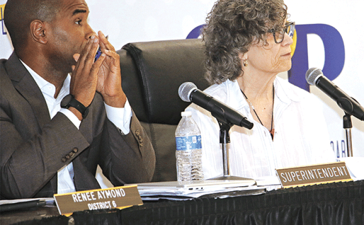 St. Landry Parish School Superintendent Milton Batiste III, left, and School Board President Mary Ellen Donatto at Thursday’s Board meeting. (Photo by Harlan Kirgan)