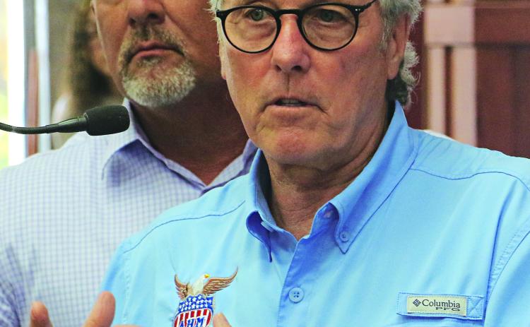 Sam Fulton, right, vice president of governmental affairs for Allegiance Health Management, and David ngram, CEO of Acadian Medical Center, attended a St. Landry Parish Council meeting on Wednesday. (Photo by Harlan Kirgan)