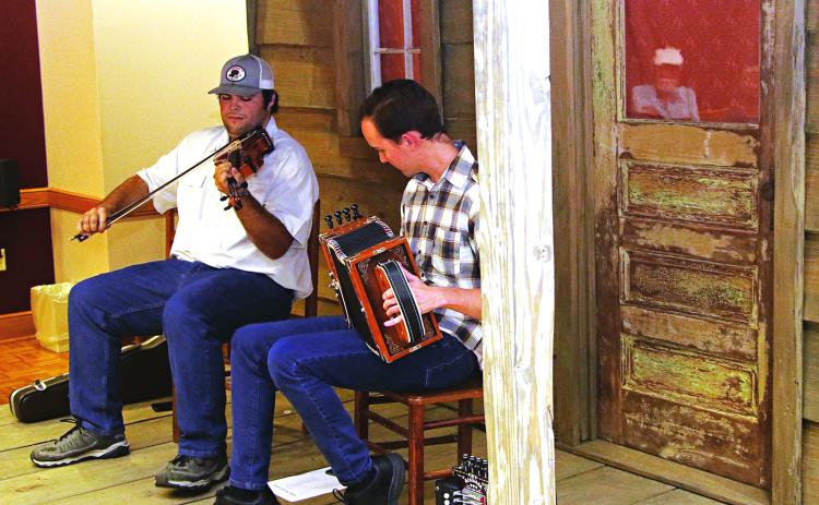 xVieille Maniere musicians, from left, Josh Elkins and Kevin Hilbun perform at the Prairie Acadian Cultural Center’s Rendezvous in the Prairie on Thursday. The program on the center’s front porch stage is an hour of performance and information about the music. The free programs are held from 5:30 to 6:30 p.m. and continue in July. The center is located t 250 W. Park Ave., Eunice. (Photos by Harlan Kirgan)