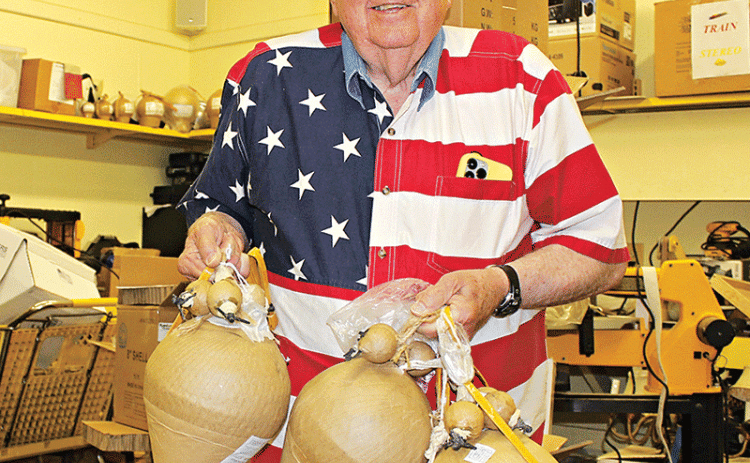 Ken Peart holds the three special shells he plans to use at the Eunice Fourth of July fireworks display. The show starts at 9 p.m. at the Eunice Recreation Complex on Sittig Road. (Photo by Myra Miller)