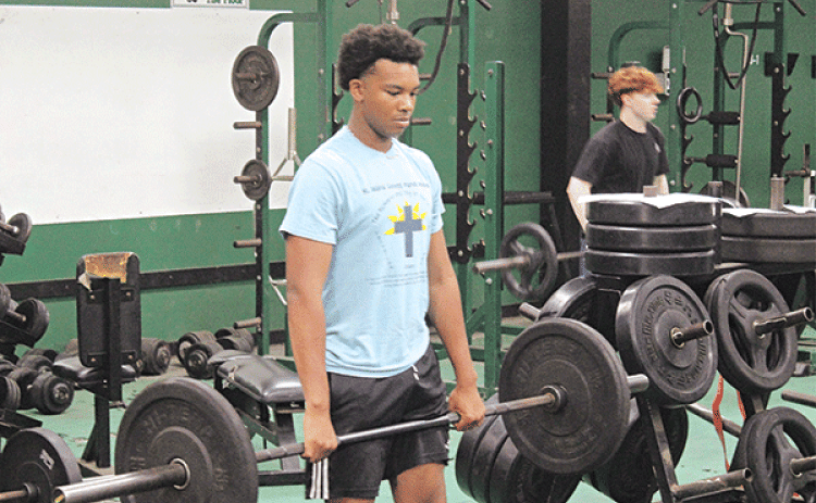 Eunice High football player Caleb Haley participates in a morning workout during the team’s summer strength and conditioning program. Summer strength and conditioning is a vital part of the development of football programs across the state and both Eunice High School and St. Edmund High School take different directions in ensuring their players reach their goals. (Photo by Rhett Manuel)