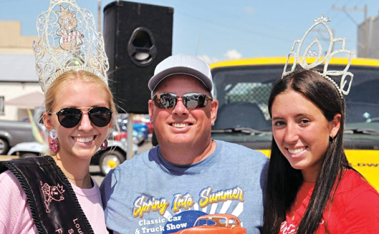 Basile Mayor Mark Denette is assisted by Miss La. Swine Festival Jynlee Conner, left, and Miss Basile Hanna Manuel. at the Eunice Classic Car and Truck Show.  (Photo provided)