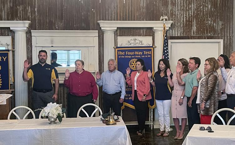A swearing in and induction of new Rotary Club officers and board members was held Wednesday at noon. Judge Ellis Daigle performed the swearing in duties. Jacob Bergeron is the new Rotary Club president. Outgoing president is Coby Clavier. From left are Judge Ellis Daigle, Jacob Bergeron, president; Pat Dossman, vice president; Shirley Vige, treasurer; Nickie Toups, secretary; Michelle DeRouen, Kitty Jo Deshotel, Donnie Richard, Carey Lawson, Erika Fontenot, Jacque Pucheu and Dwight Jodon, board members. (S