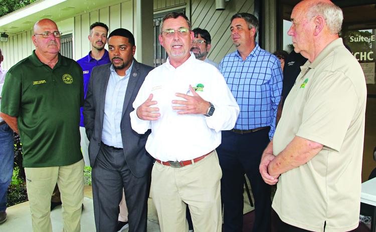 St. Landry Parish President Jessie Bellard explains how $1.5 million in state funding will pay for the Eunice Community Health Center to relocate to a renovated portion of the former Moosa Hospital during a ceremony on Thursday. From left, are Timmy Lejeune, Parish Council member; Chad Andrepont, city alderman; Rep. Dustin Miller; Bellard; Chip Thibodeaux, hospital board chariman; Scott Fontenot, mayor; and Ernest Blanchard, Parish Council member. Parish Council member Jimmie Edwards is behind Blanchard at