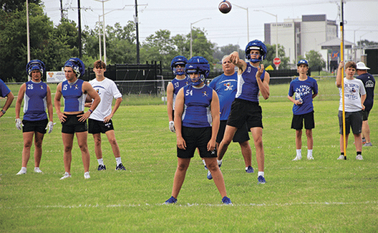 St. Ed’s junior quarterback Nathan Zaunbrecher fires a pass downfield during the Air It Out seven-on-seven tournament Wednesday evening at St. Thomas More. This contest is one of between 50 and 60 contests that head coach James Shiver estimates his team has participated in this summer. (Photos by Rhett Manuel)