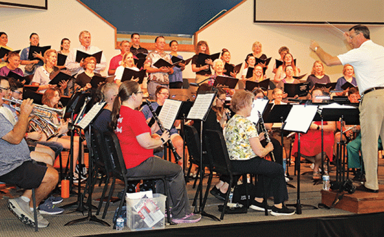 Director Dwight Jodon leads the Eunice Community Concert Band & Community Choir during practice Tuesday for the Summer Concert scheduled at 7 p.m. today and Friday at the First Baptist Church in Eunice. The program selections include, “Papa Loves Mambo” “When I’m Sixty-Four,” “The Prayer,” “We Don’t Talk About Bruno”, “Espana Cani,” “Nessun Dorma”, “Hey Baby,” “Tribute to Gershwin,” “Love Is an Open Door,” “We Will Remember,” “The Jungle Book,” “Hernando’s Hideaway,” and “Sheherazade.” Tickets are  $5 for a