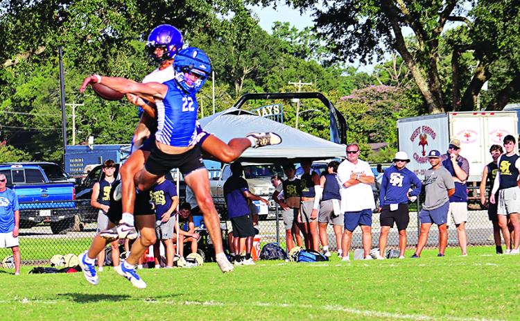 Blue Jay Wyatt Dubois tangles with Opelousas Catholic player during the 7-on-7 game that was part of a 16-team tournament on July 16.   (Photos by Amy Myers)