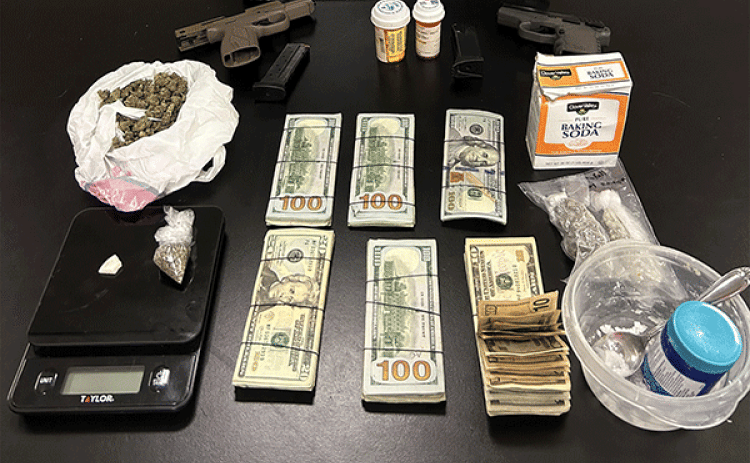 St. Landry Parish Sheriff’s narcotics detectives and SWAT team members forced a door open to make an arrest and seize guns and drugs from an Opelousas residence on July 15, according to Sheriff Bobby Guidroz.