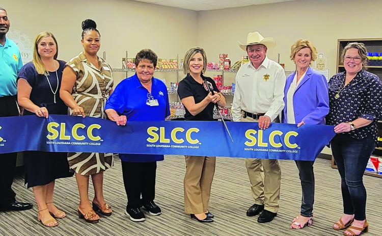SLLC announces its expansion of its Food Pantry. From left, are Ville Platte Chief of Police Perry Thomas, Brittany Ducote (SLCC), Carleen Jones (SLCC), Mabel Foreman (LHC Group), Lana Fontenot (SLCC), Evangeline Parish Sheriff Charles Guillory, State Representative Rhonda Butler (District 38), and Maggi Bienvenu (One Acadiana) Submitted photo.