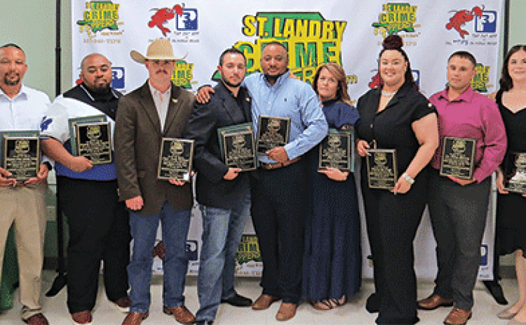 From left, are: Sgt. Elizabeth Bernard, with Crime Stoppers; Deputy Chief Jeremy Ivory,  Supervisor of the Year, Eunice Police Department; Deputy Timothy Lazare, Correctional Officer of the Year, St. Landry Sheriff’s Office; Capt. Cody Richard-Officer of the Year, St. Landry Sheriff’s Office; Lt. Drake Pousson, Judge Robert Brinkman Superior Officer of the Year, St. Landry Sheriff’s Office; Lt. Julian Tibbs, Judge Robert Brinkman Superior Officer of the Year,  St. Landry Sheriff’s Office; Lt. Regina Rinaldi