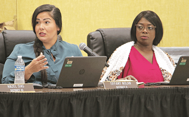 St. Landry Parish School Board members, from left, Tiffany Nolan and Timmakah Hardy at Thursday’s Board meeting in Opelousas. Nolan was commenting on a proposed school study by demographer Mike Hefner. (Photo by Harlan Kirgan)