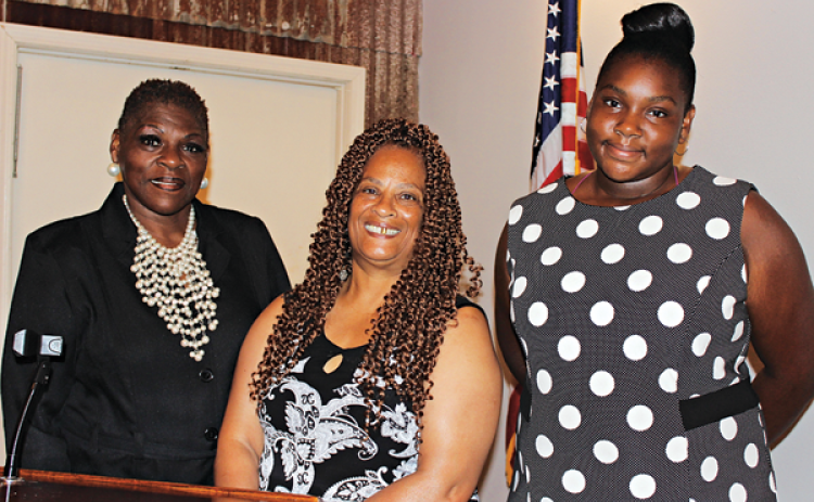 Bobbie Brown, founder of Sister2Sisters, was the guest speaker at Eunice Rotary Club Wednesday. She invited her daughter and friends to the meeting. From left are Brown, Priscilla Simon, and Shakaria Brown, Brown’s daughter. (Photo by Myra Miller)