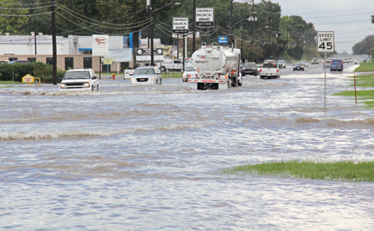 Flooding rains occurred at about 5 p.m. Tuesday in Eunice. U.S. 190 is shown flooded by the Amy Shopping Center, which is a normal placing for flooding when heavy rains occur.