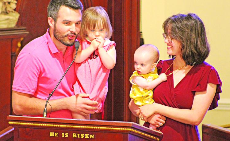 The Stansbury Family, Ryan and Sophie and their daughters Cecilia and Charlene, address the crowd at the annual Charlene Richard Mass. The family prayed to the “The Little Cajun Saint” for a healthy birth of their daughter Charlene. (Photos by Claudette Olivier/The Church Point News)