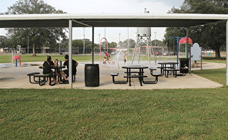 The addition of tables at the splash pad at Fairground Park in Eunice has made enjoying the outdoors easier this year. The area is covered allowing the adults shade and a seating area while the children play in the water. There is another splash pad behind Central Middle School. (Photo by Harlan Kirgan)