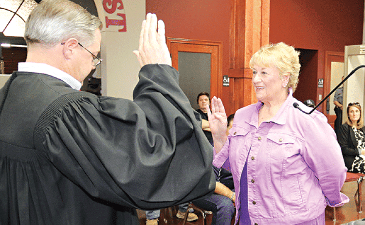 Lynn Lejeune recites the oath of office presented by District Judge Jason Meche at Wednesday’s St Landry Parish Council meeting in Opelousas. Lejeune was voted as interim Council member for District 13 to replace Coby Clavier, who resigned in July (Photo by Harlan Kirgan)