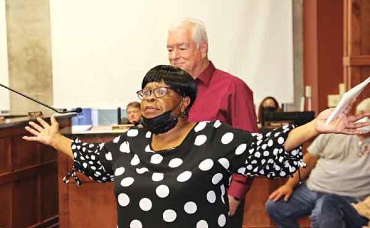 St. Landry Parish Registrar Cheryl Milburn and demographer Mike Hefner were among those who spoke at the St. Landry Parish Council meeting on Wednesday. (Photo by Harlan Kirgan)